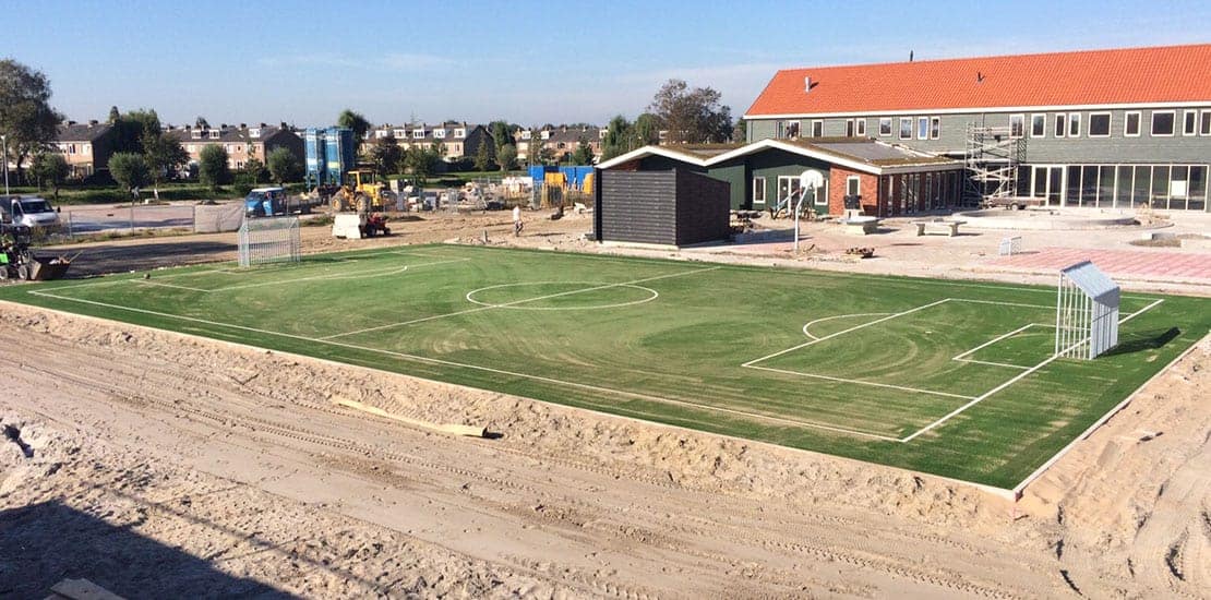 Aanleg kunstgras voetbalveld